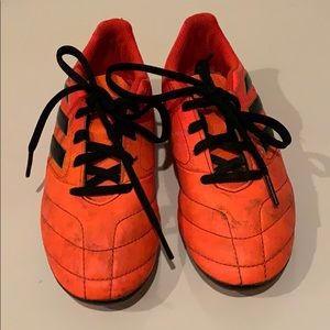 Orange ADIDAS cleats size 1